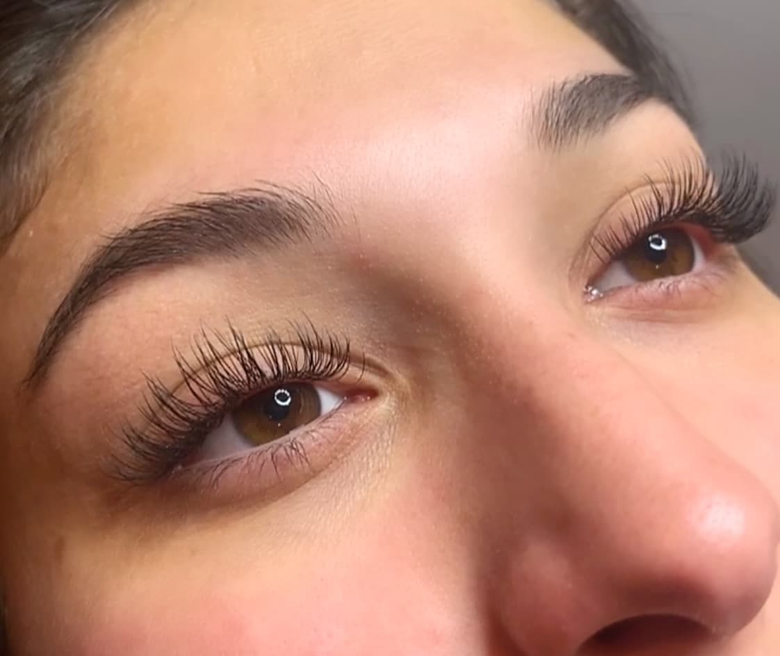 Real client showing Hybrid lash extension result applied at Lovely Lilly's North Austin studio